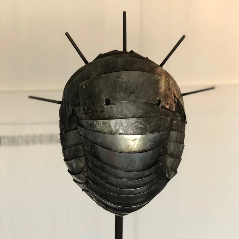 Paolo Fiorellini, maschera "Corona", Ecce Homo, alluminio e tela di iuta, 30x180